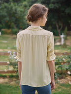 Blouse broderie florale col V manches courtes pour femme