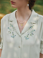 Blouse broderie florale col V manches courtes pour femme