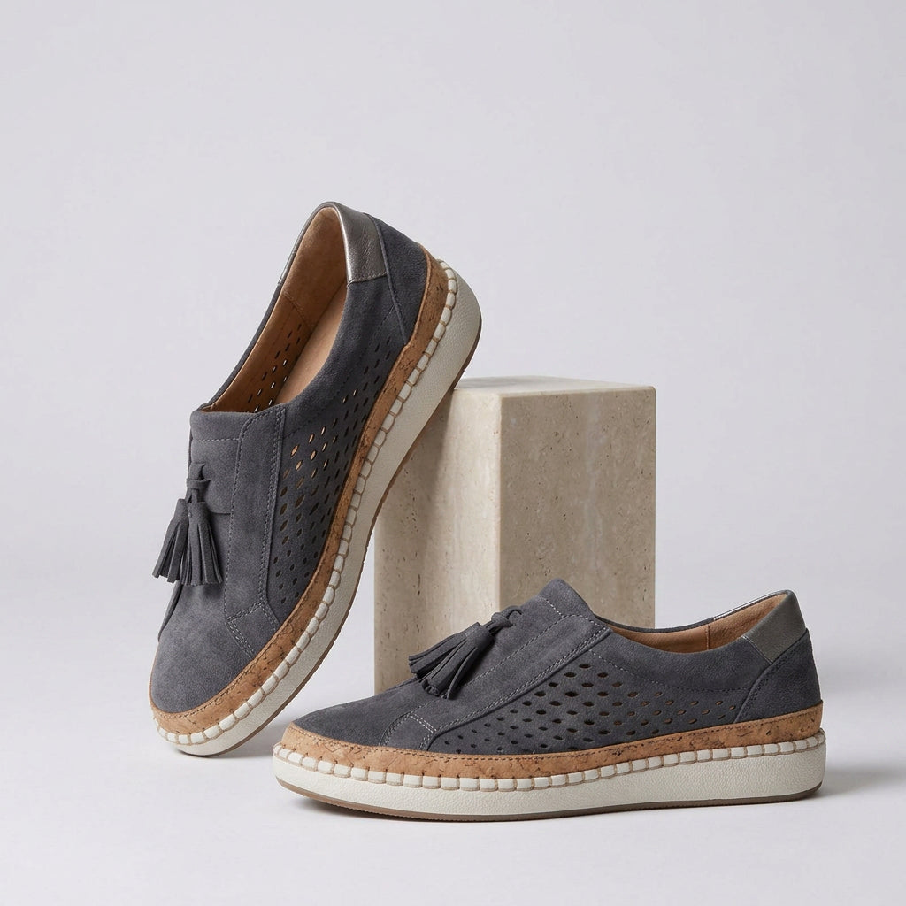 Chaussures slip-on perforées à pompons compensées noir pour femme