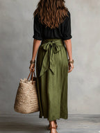 Ensemble chemise noire et jupe midi verte ceinturée pour femme