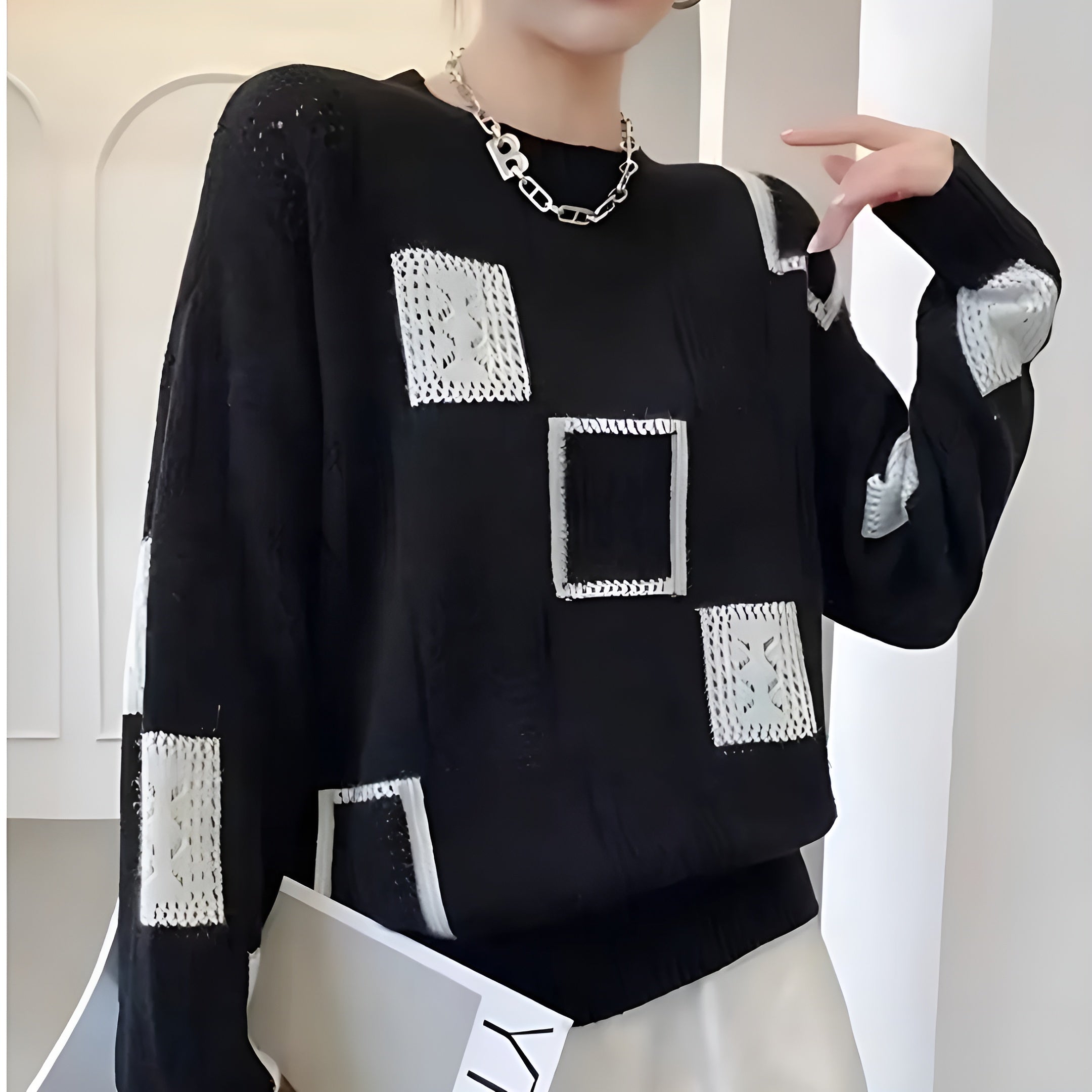 Pull col rond motif graphique bicolore noir pour femme