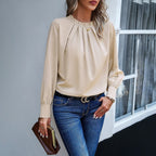 Blouse beige plissée col montant manches longues, vue de face