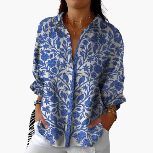 Blouse femme en coton blanc à imprimé floral bleu, manches longues, vue de face