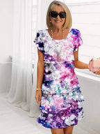 Robe midi fleurie portée de profil montrant la longueur sous le genou