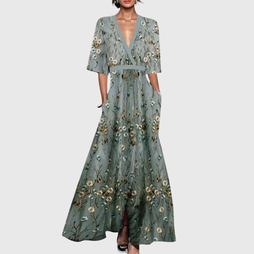 Détail de l'imprimé floral bleu et gris en bas de robe